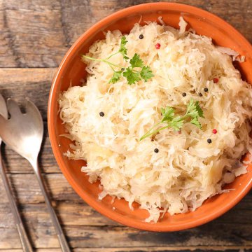 bowl of sauerkraut on table with fork